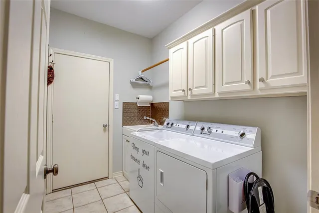 a living room with patio furniture and a fireplace