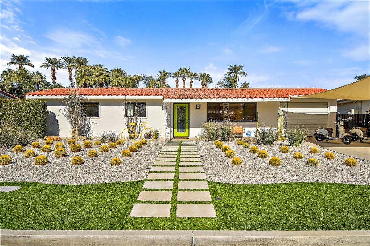 70140 Sun Valley Drive Rancho Mirage, CA 92270 - Photo 1 of 36 a view of a house with swimming pool and sitting area