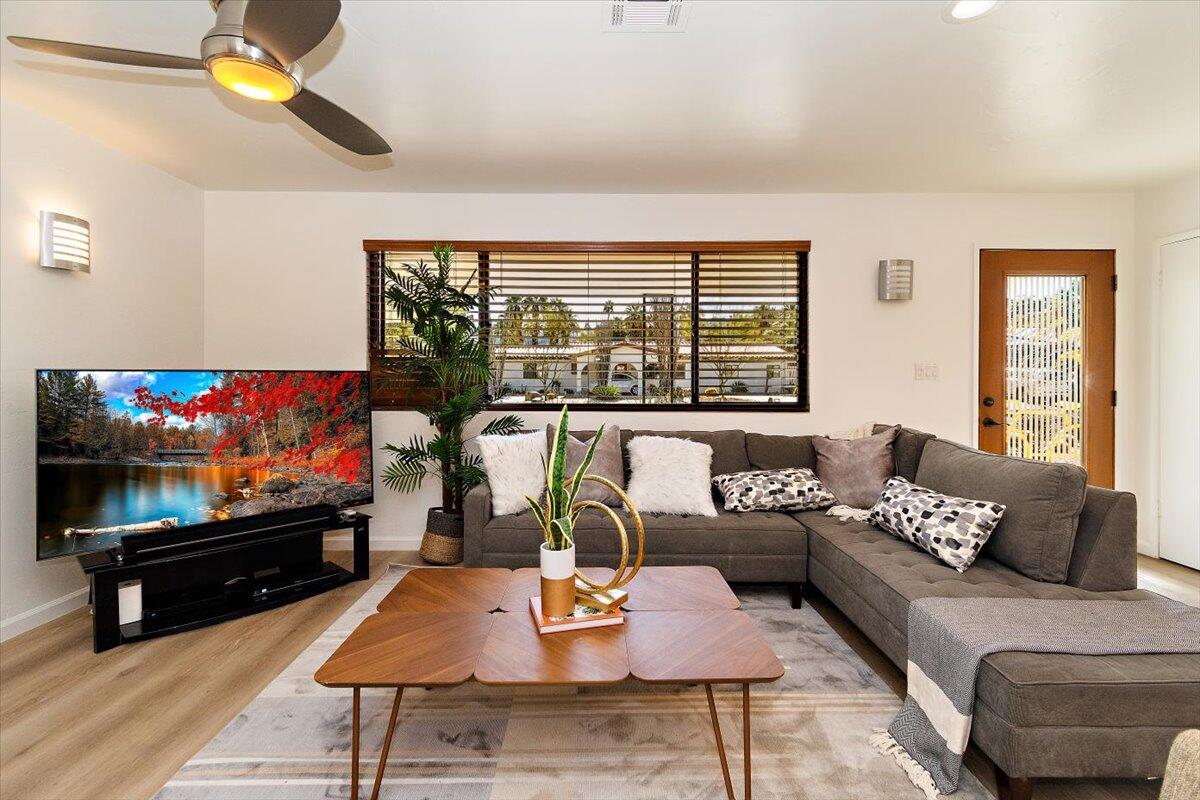 70140 Sun Valley Drive Rancho Mirage, CA 92270 - Photo 12 of 36 a living room with furniture and a flat screen tv