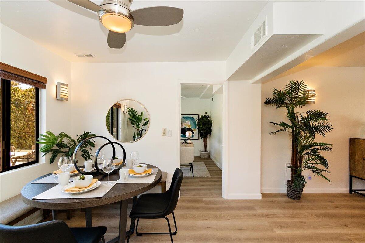 70140 Sun Valley Drive Rancho Mirage, CA 92270 - Photo 15 of 36 a view of a dining room with furniture and wooden floor