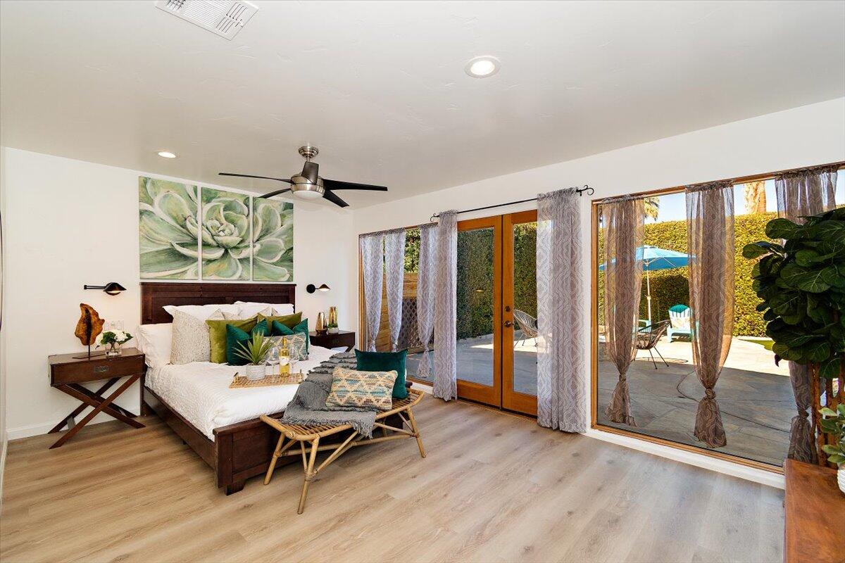 70140 Sun Valley Drive Rancho Mirage, CA 92270 - Photo 16 of 36 a living room with furniture wooden floor and floor to ceiling window