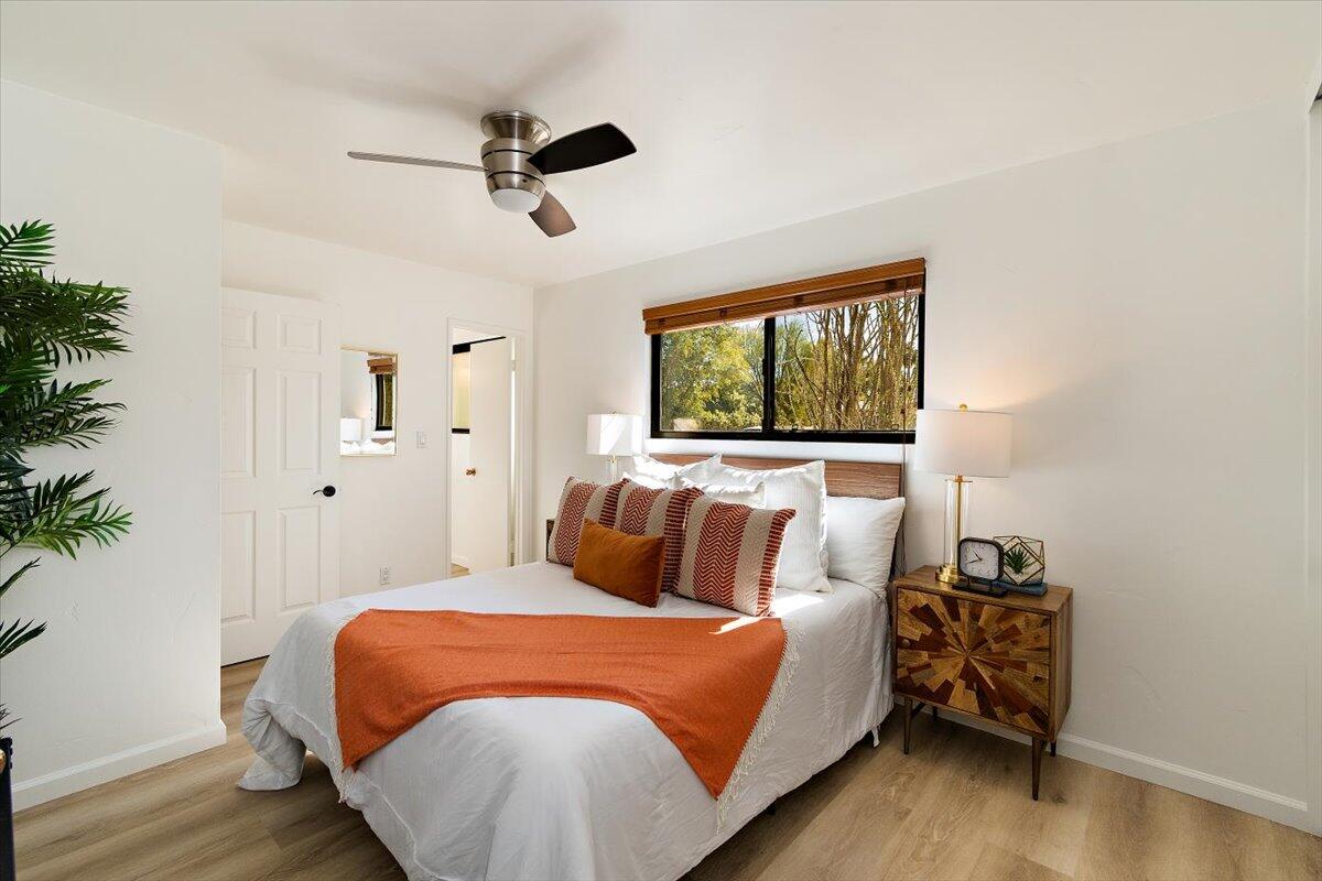 70140 Sun Valley Drive Rancho Mirage, CA 92270 - Photo 21 of 36 a bedroom with a bed and wooden floor