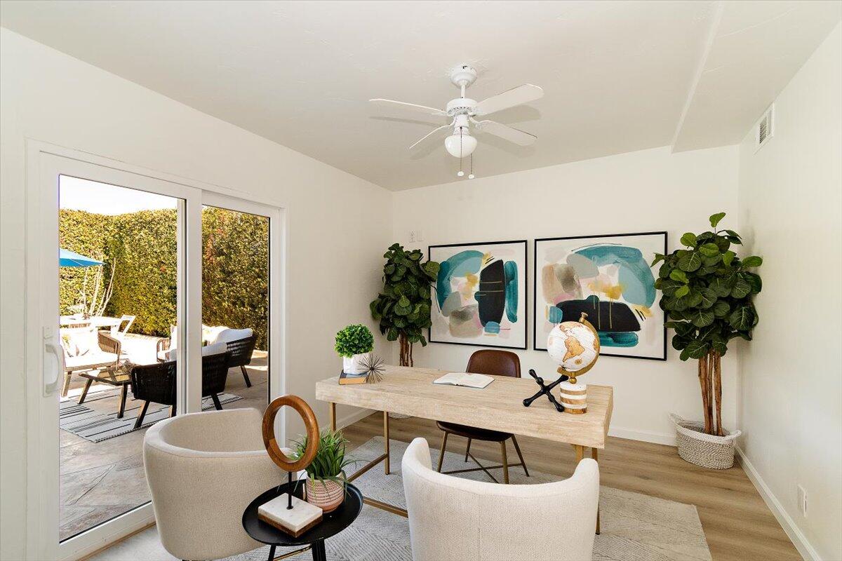 70140 Sun Valley Drive Rancho Mirage, CA 92270 - Photo 24 of 36 a living room with furniture and a large window