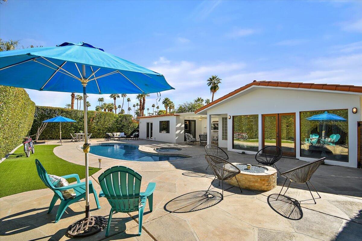 70140 Sun Valley Drive Rancho Mirage, CA 92270 - Photo 25 of 36 a view of a house with swimming pool and sitting area