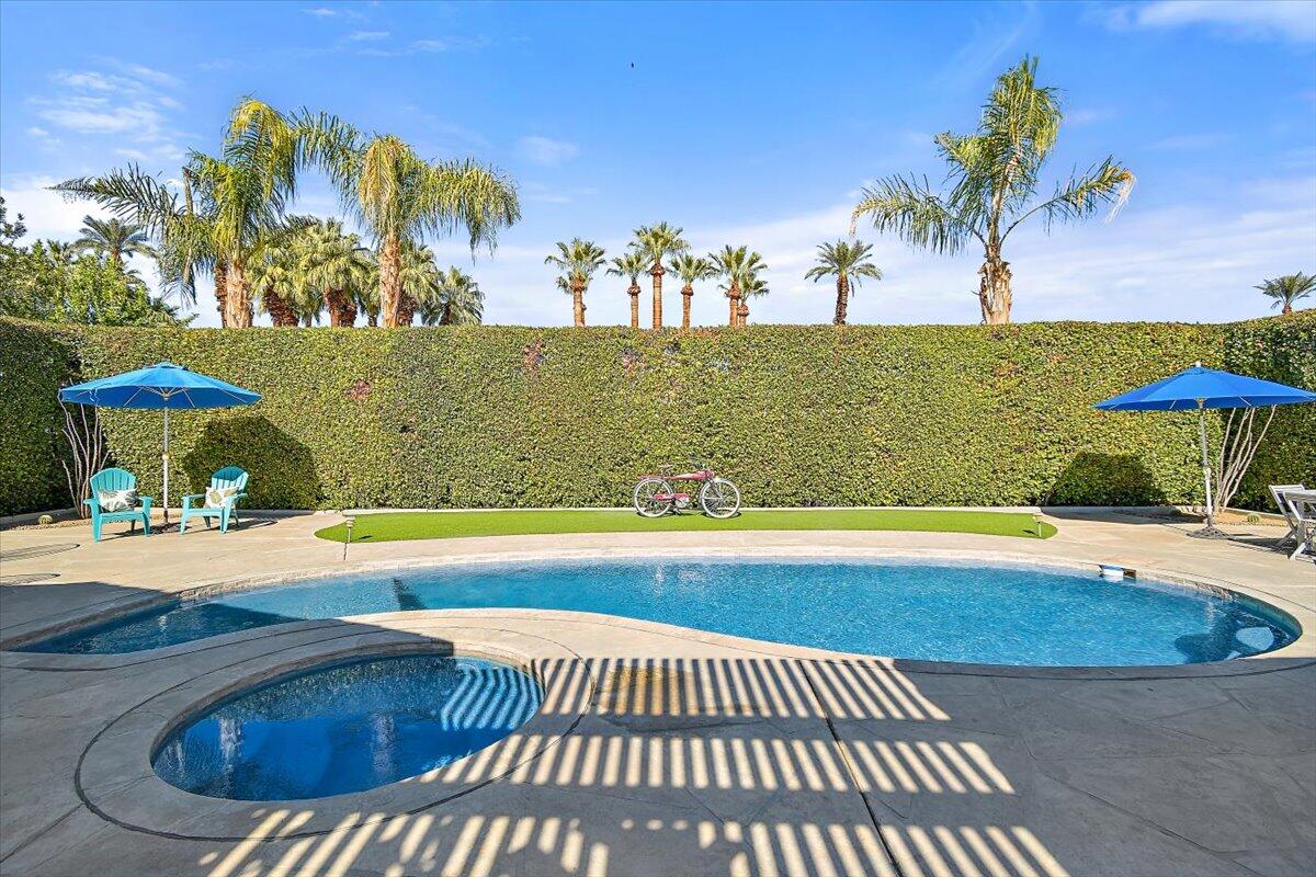 70140 Sun Valley Drive Rancho Mirage, CA 92270 - Photo 3 of 36 a view of a swimming pool and an outdoor space