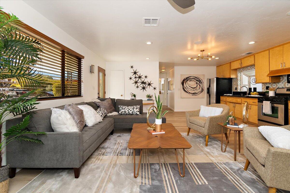 70140 Sun Valley Drive Rancho Mirage, CA 92270 - Photo 5 of 36 a living room with furniture and a large window
