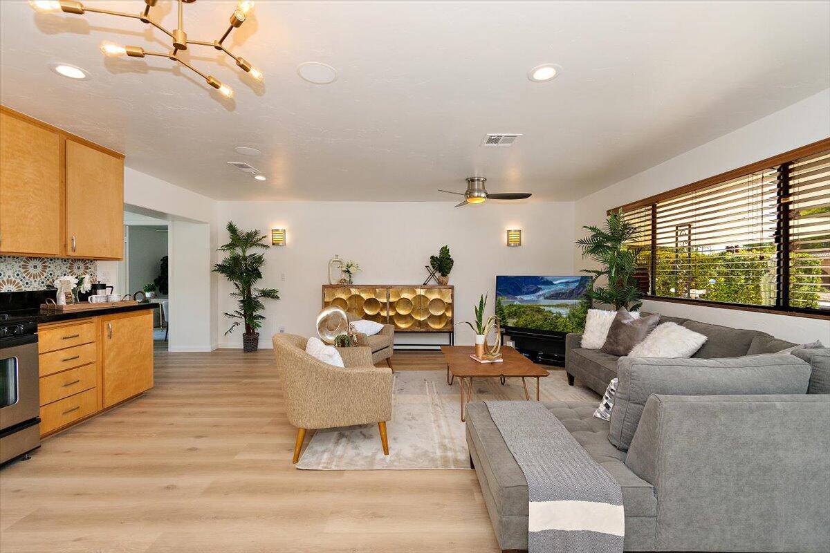70140 Sun Valley Drive Rancho Mirage, CA 92270 - Photo 8 of 36 a living room with furniture and a large window