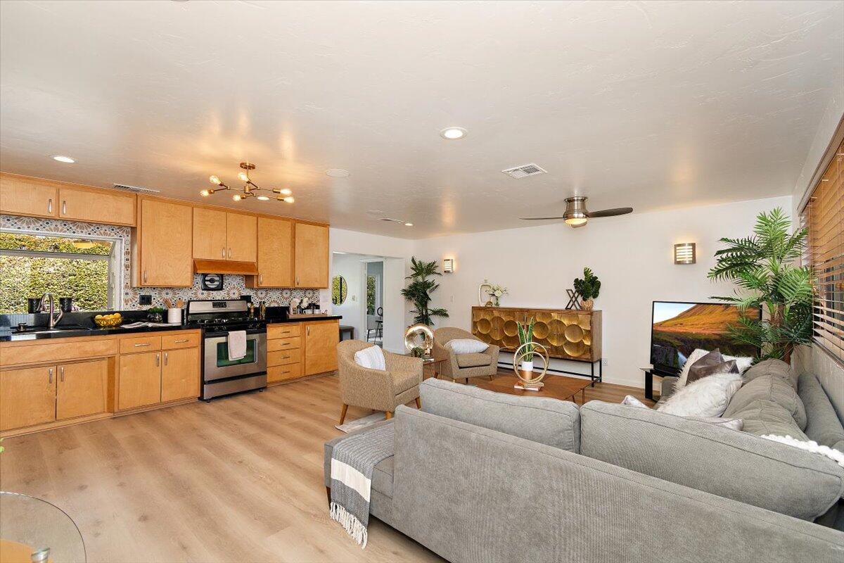 70140 Sun Valley Drive Rancho Mirage, CA 92270 - Photo 9 of 36 a living room with furniture kitchen view and a large window