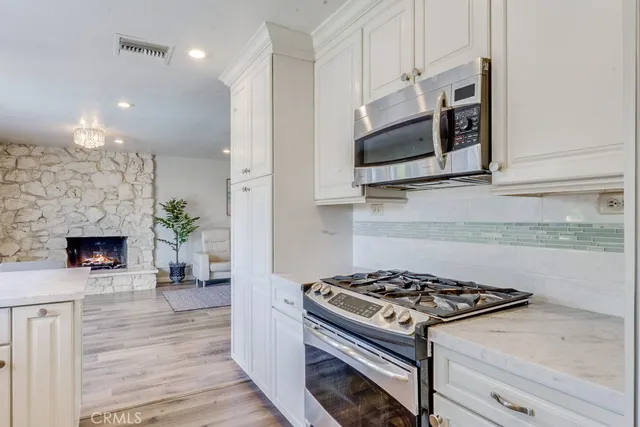 a kitchen with a stove and a microwave
