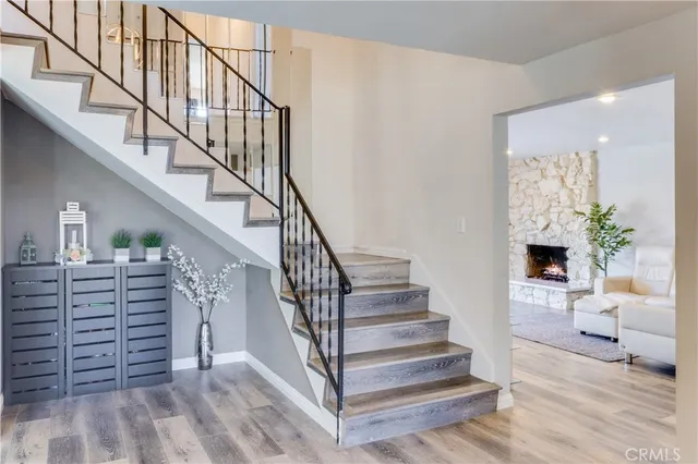 a view of entryway and hall with wooden floor