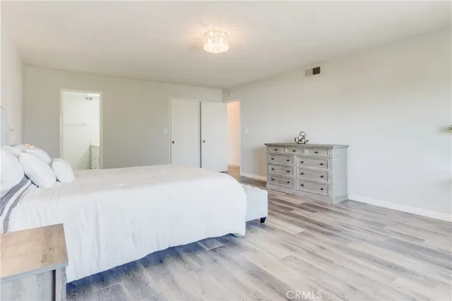 a bedroom with a bed and a cabinets