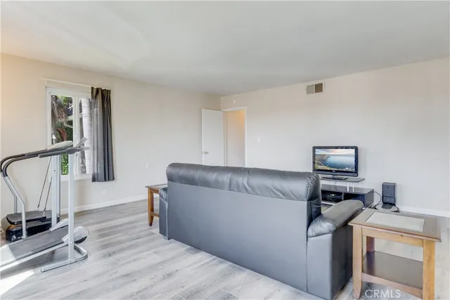 a living room with a couch and a stove top oven