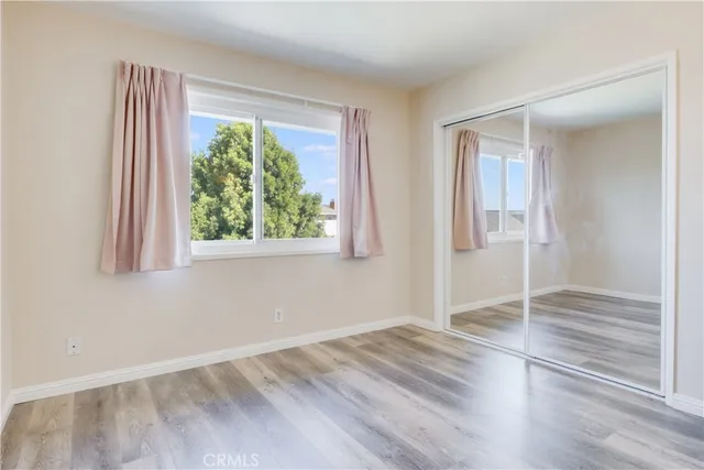 a view of an empty room with closet area