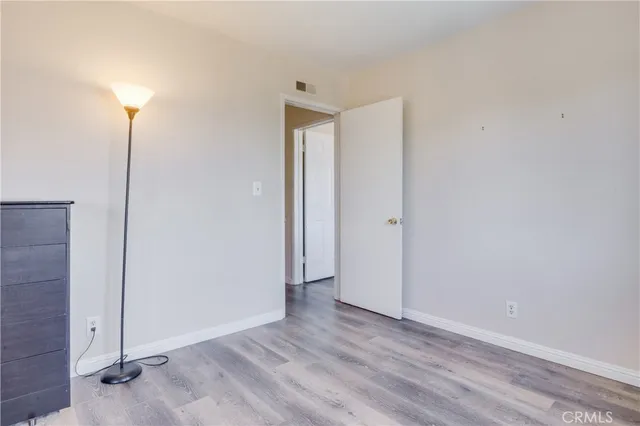 a picture of a wall with a white bed