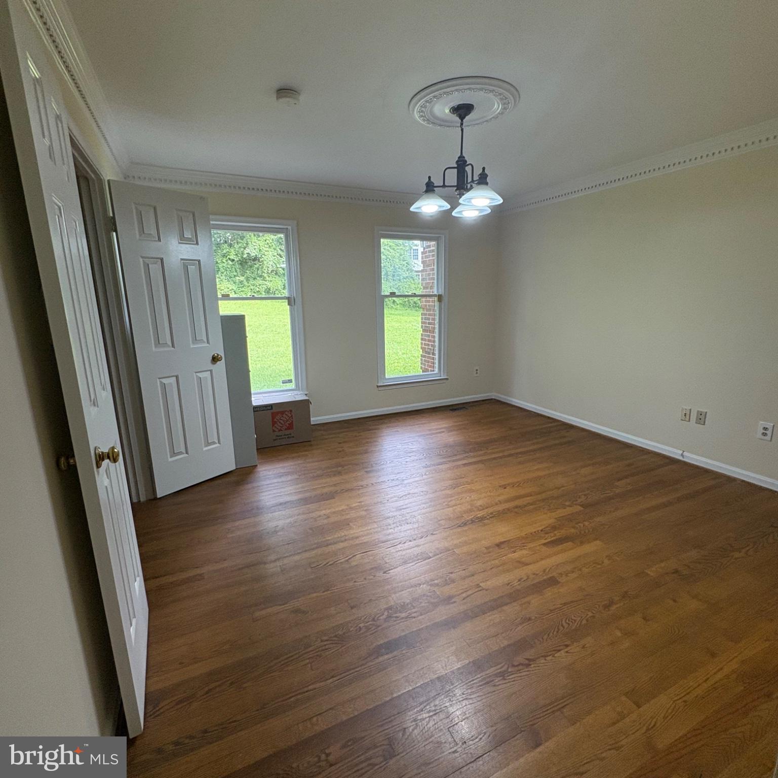 3502 Holly Road Annandale, VA 22003 - Photo 15 of 57 an empty room with wooden floor and windows