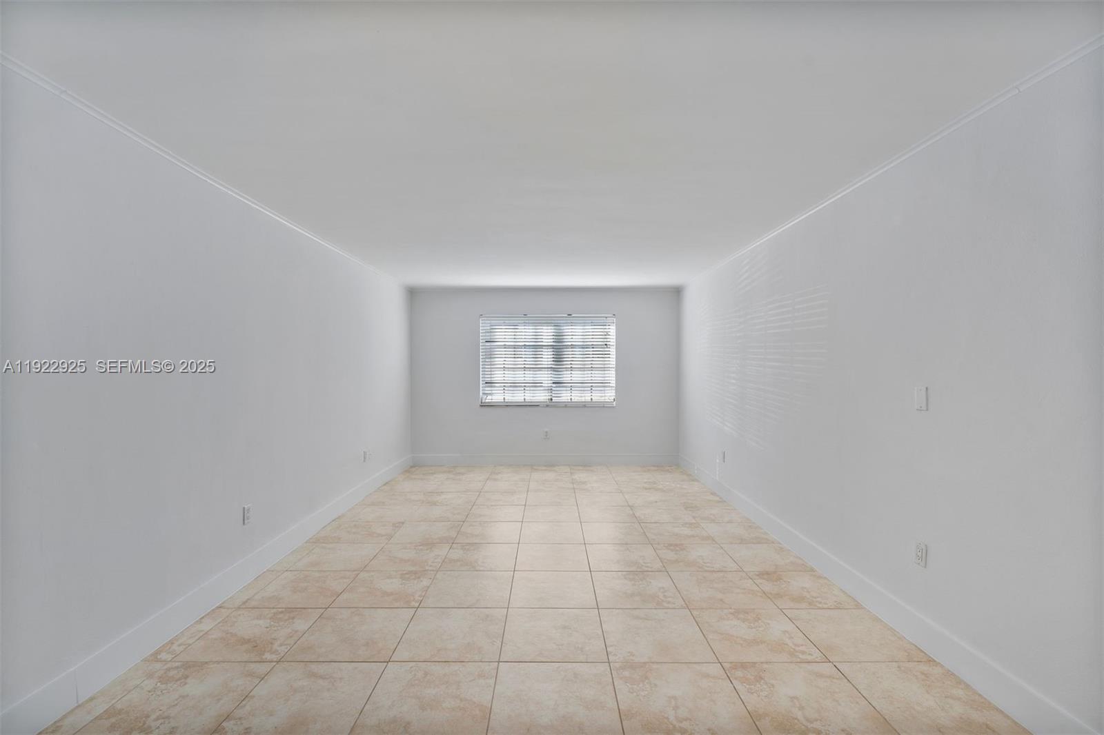 201 Galen Drive, Unit 104 Key Biscayne, FL 33149 - Photo 12 of 17 an empty room with windows