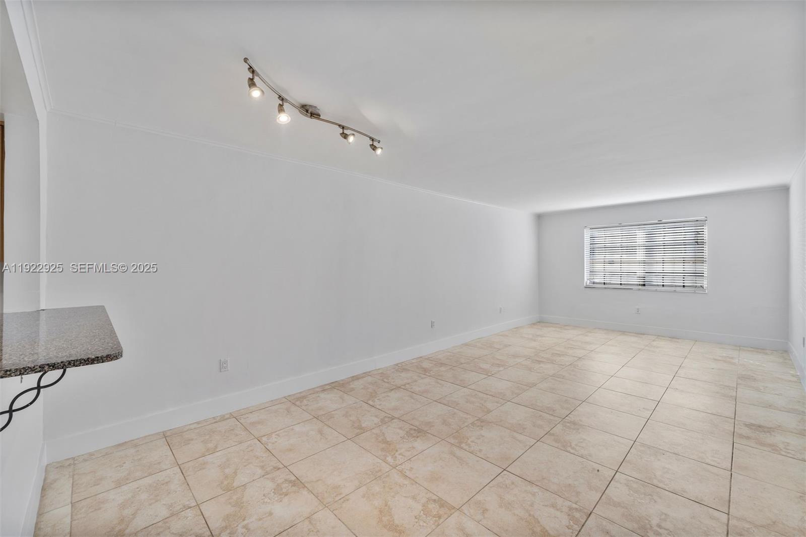 201 Galen Drive, Unit 104 Key Biscayne, FL 33149 - Photo 2 of 17 a view of an empty room and a window