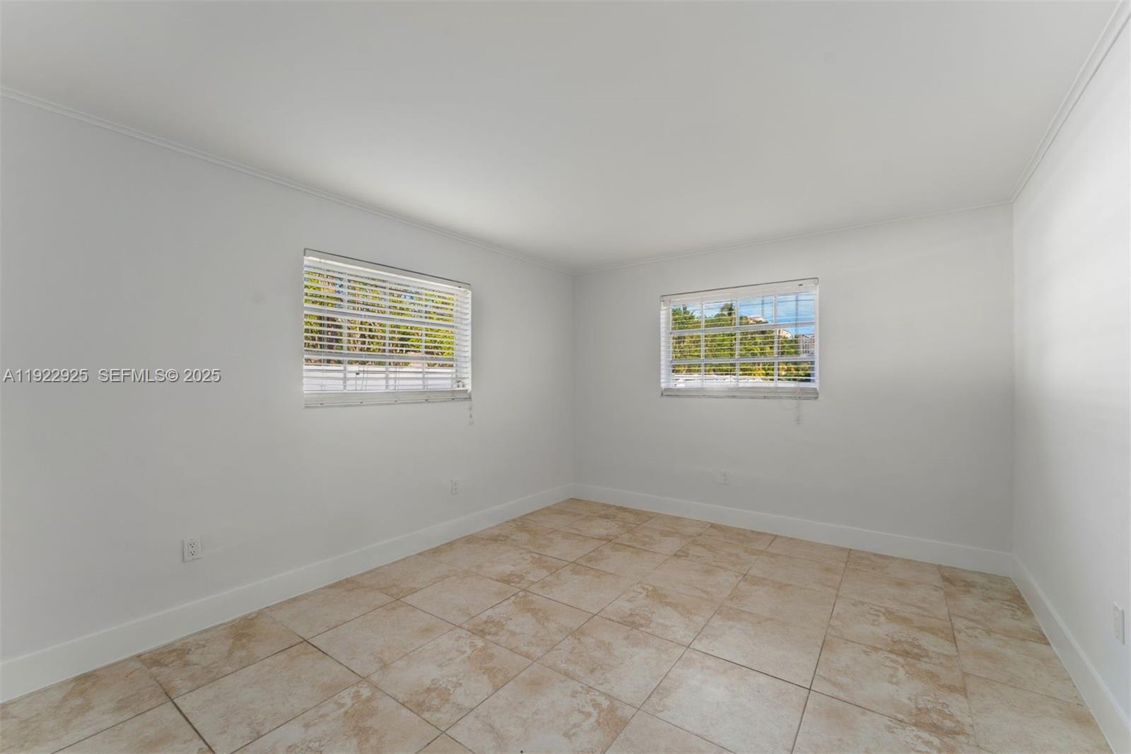 201 Galen Drive, Unit 104 Key Biscayne, FL 33149 - Photo 9 of 17 an empty room with windows