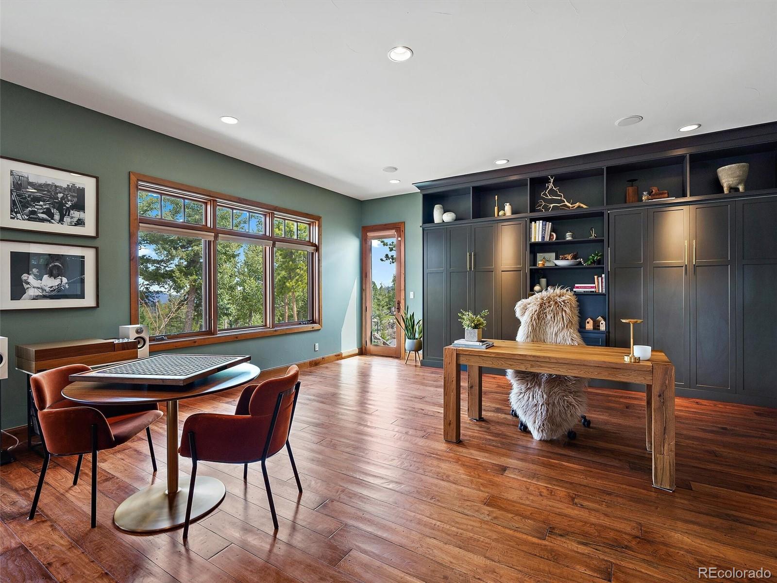 32024 Snowshoe Road Evergreen, CO 80439 - Photo 24 of 50 a dining room with furniture and window