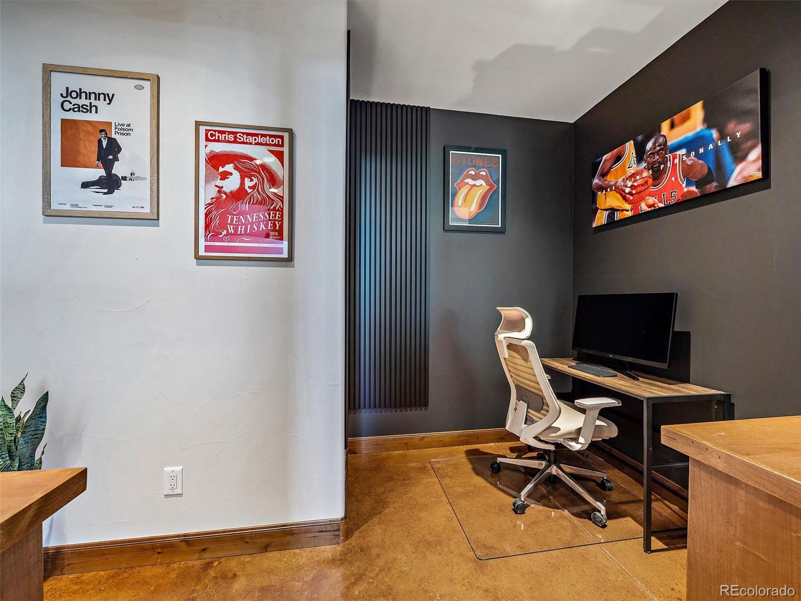 32024 Snowshoe Road Evergreen, CO 80439 - Photo 34 of 50 a view of a workspace with furniture and a flat screen tv
