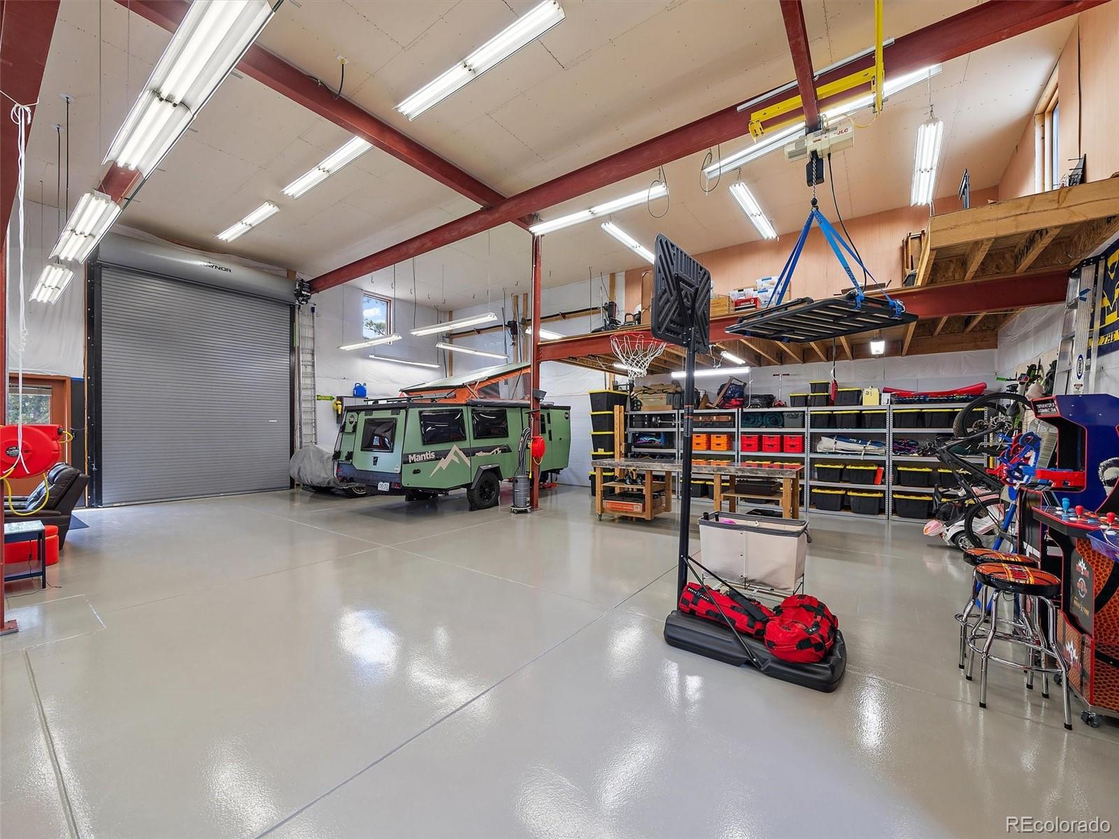 32024 Snowshoe Road Evergreen, CO 80439 - Photo 47 of 50 a car and bike garage