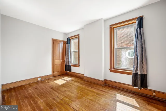 a view of an empty room and window