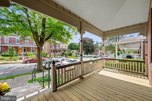 a view of a porch with wooden floor and outdoor space