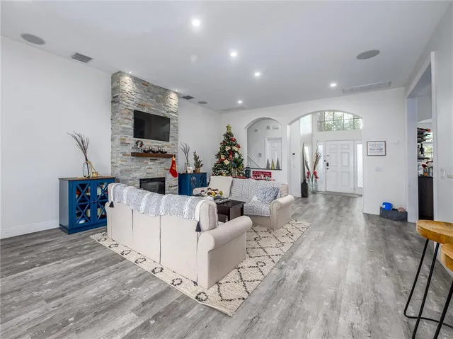 a kitchen with a refrigerator a sink a stove a microwave and cabinets
