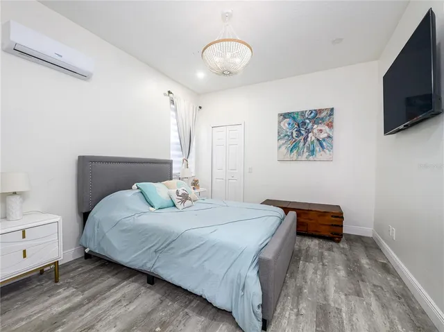 a bed room with a bed and a window