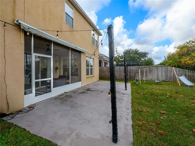 a view of a house with a yard porch and sitting area