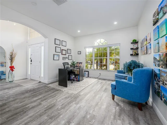 a view of a dining room with furniture window and wooden floor