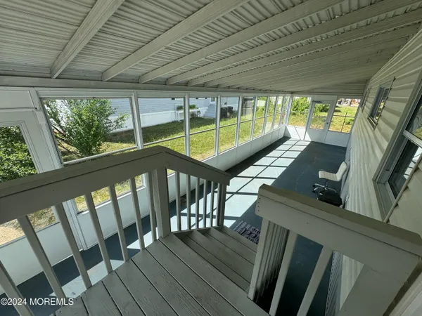 a view of a balcony with chairs