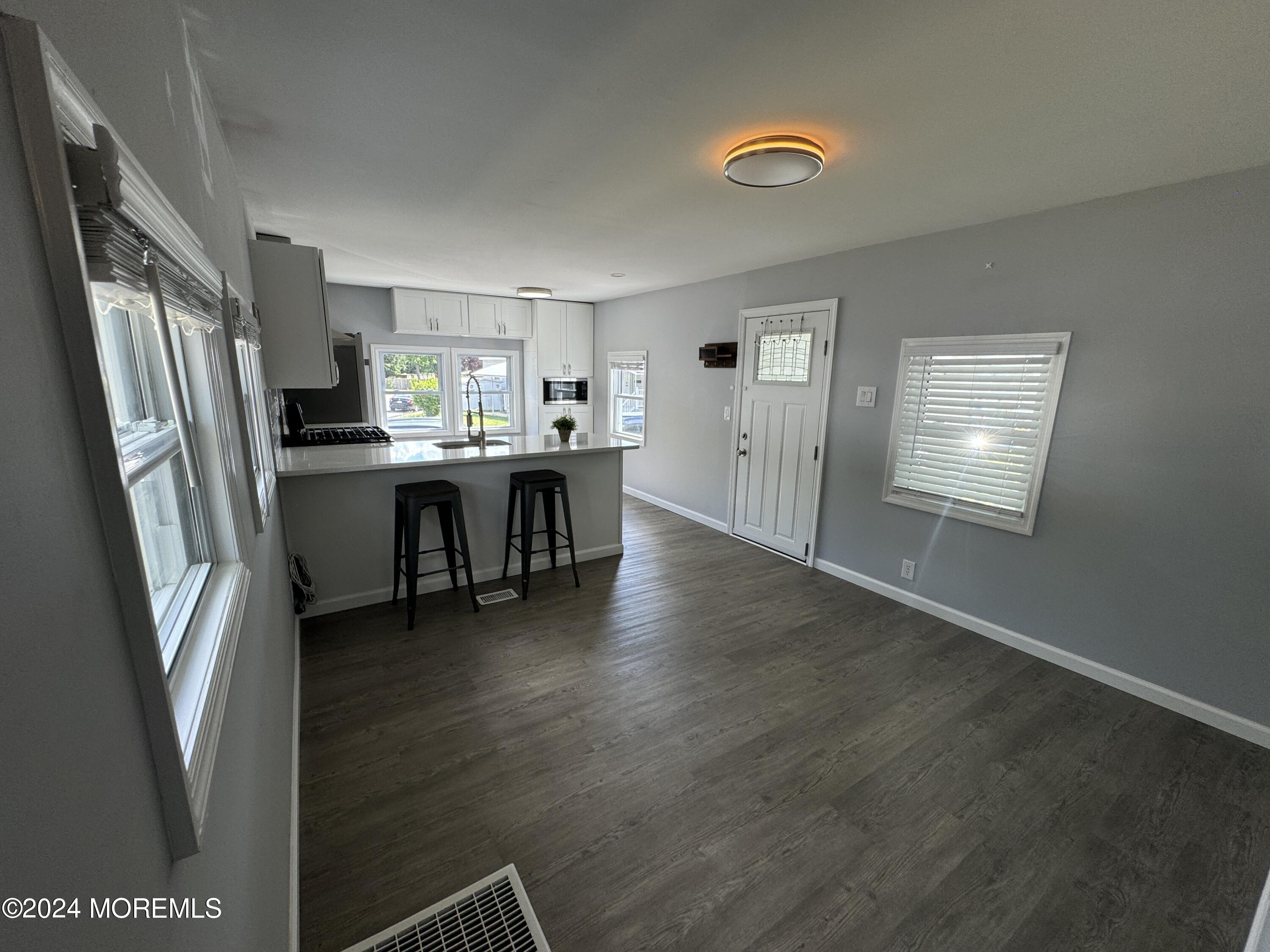 422 4th Street Jackson, NJ 08527 - Photo 4 of 17 a view of a dining room with furniture window and wooden floor