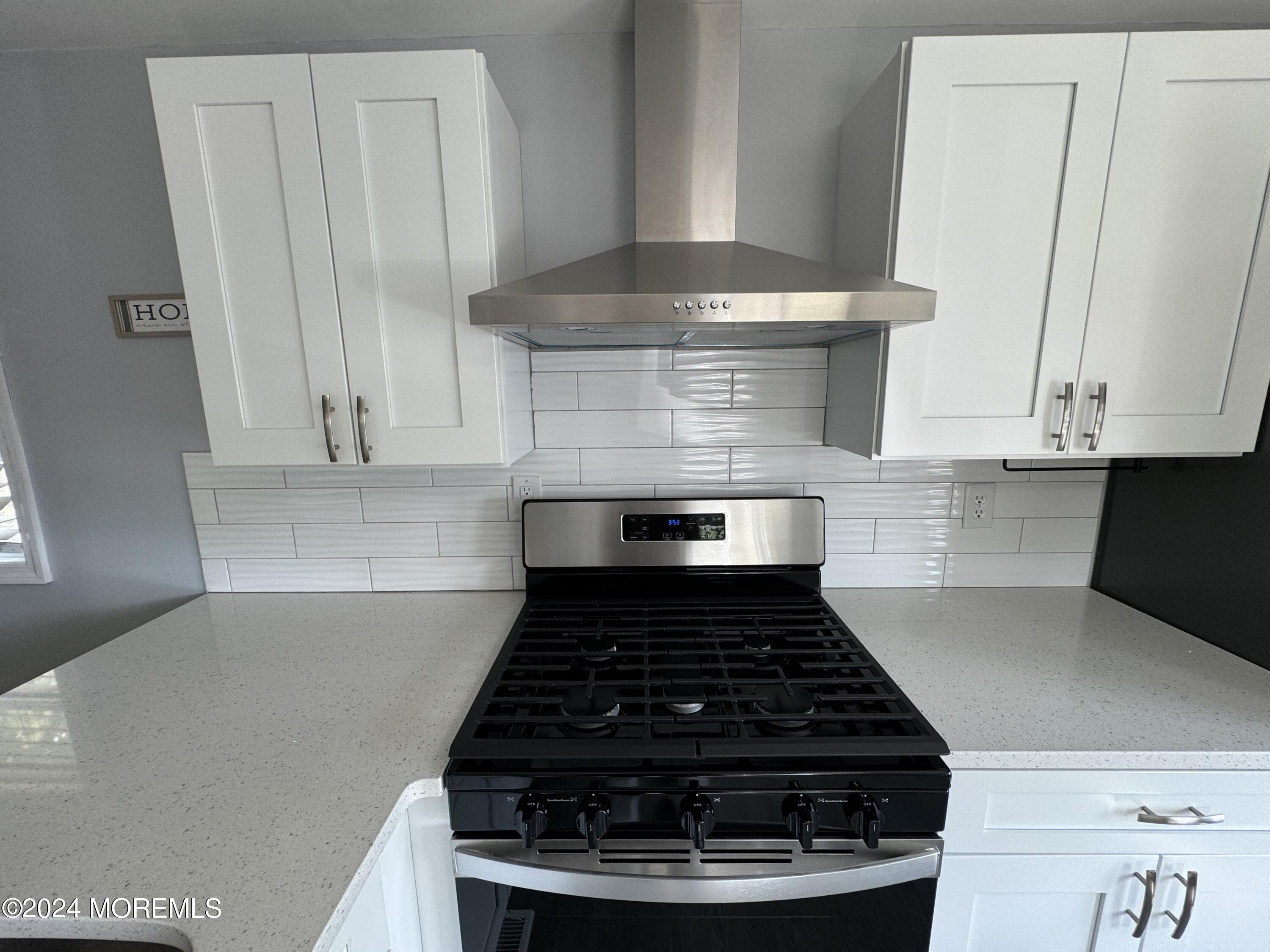 422 4th Street Jackson, NJ 08527 - Photo 8 of 17 a stove top oven sitting inside of a kitchen