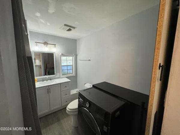 a kitchen with a sink and a stove top oven