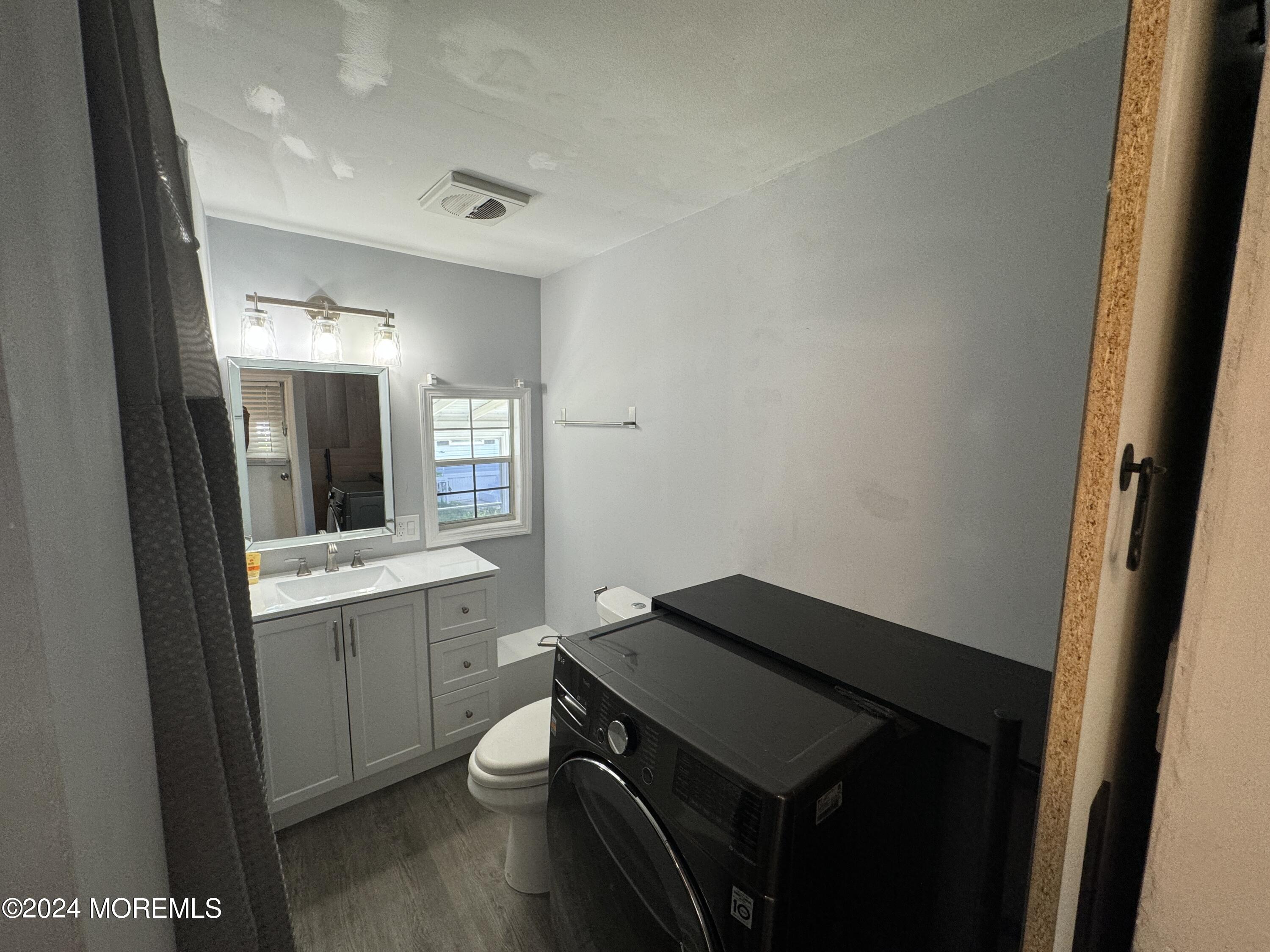 422 4th Street Jackson, NJ 08527 - Photo 9 of 17 a kitchen with a sink and a stove top oven