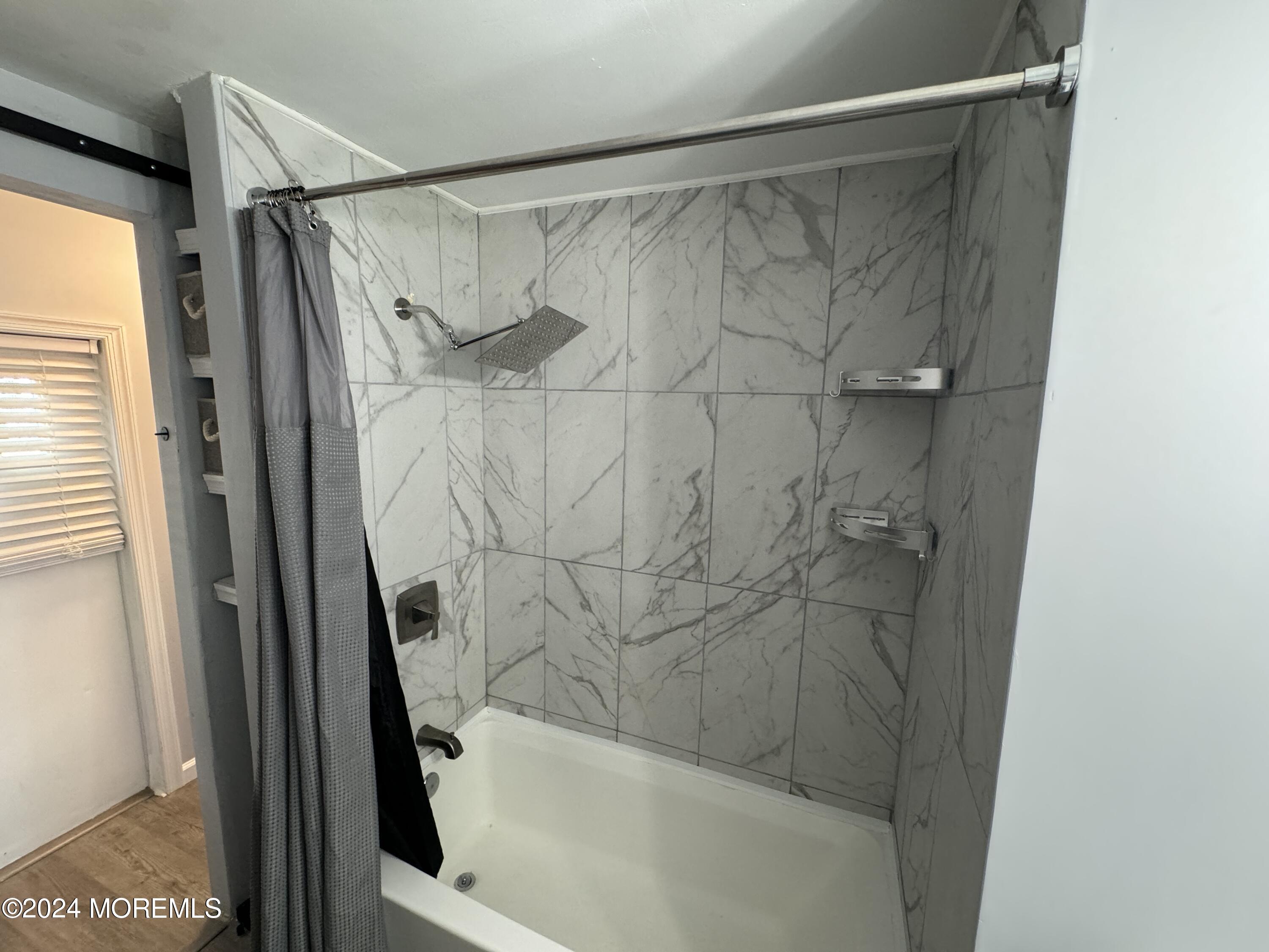 422 4th Street Jackson, NJ 08527 - Photo 10 of 17 a bathroom with a shower and a bath tub