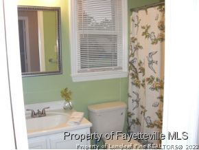 4938 Black Bridge Road Parkton, NC 28371 - Photo 13 of 17 a bathroom with a sink and a mirror
