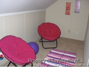 4938 Black Bridge Road Parkton, NC 28371 - Photo 14 of 17 a view of a room with table and a chair