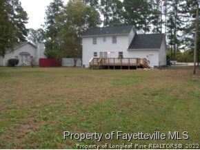 4938 Black Bridge Road Parkton, NC 28371 - Photo 16 of 17 a front view of house with yard and trees in the background