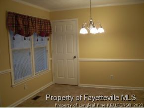 4938 Black Bridge Road Parkton, NC 28371 - Photo 5 of 17 a view of a chandelier in big room