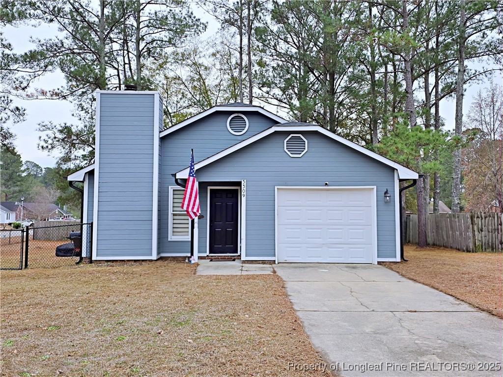 5309 Tory Hill Road Hope Mills, NC 28348 - Photo 1 of 45 a front view of house with garage