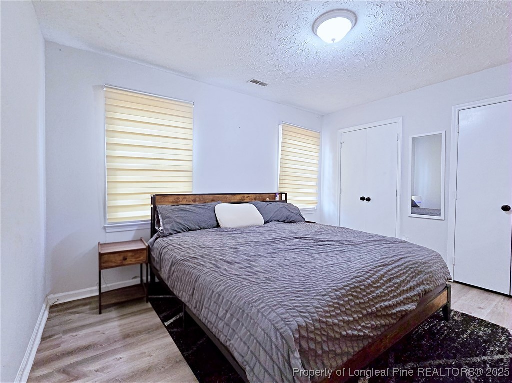 5309 Tory Hill Road Hope Mills, NC 28348 - Photo 18 of 45 a bedroom with a bed and a window