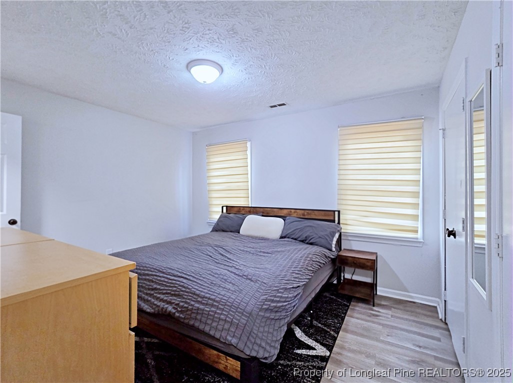 5309 Tory Hill Road Hope Mills, NC 28348 - Photo 19 of 45 a bedroom with a bed and window