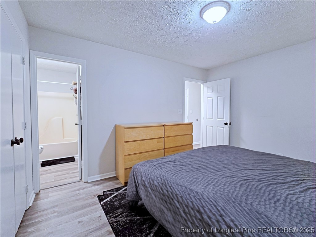 5309 Tory Hill Road Hope Mills, NC 28348 - Photo 21 of 45 a bedroom with a bed and a closet