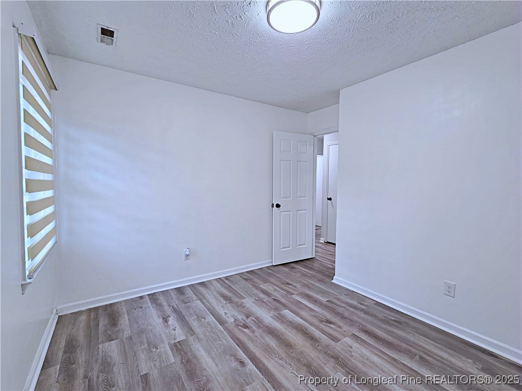 5309 Tory Hill Road Hope Mills, NC 28348 - Photo 25 of 45 a view of room with window and hardwood floor