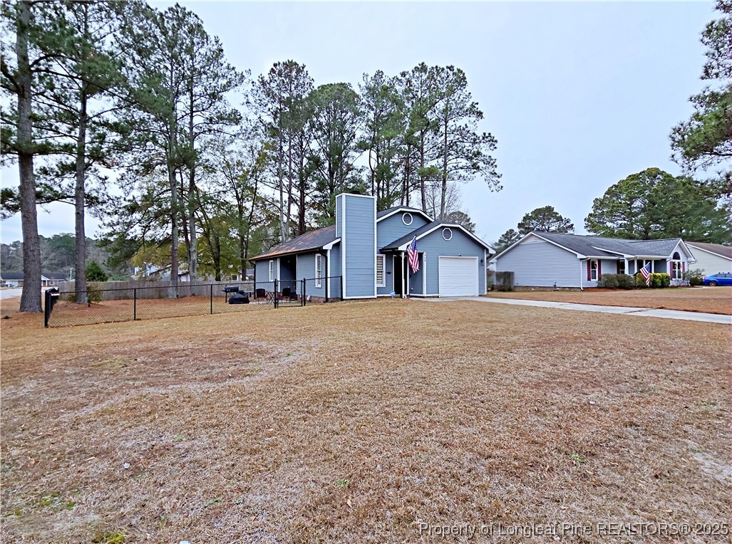 5309 Tory Hill Road Hope Mills, NC 28348 - Photo 32 of 45 a view of house with outdoor space and street view