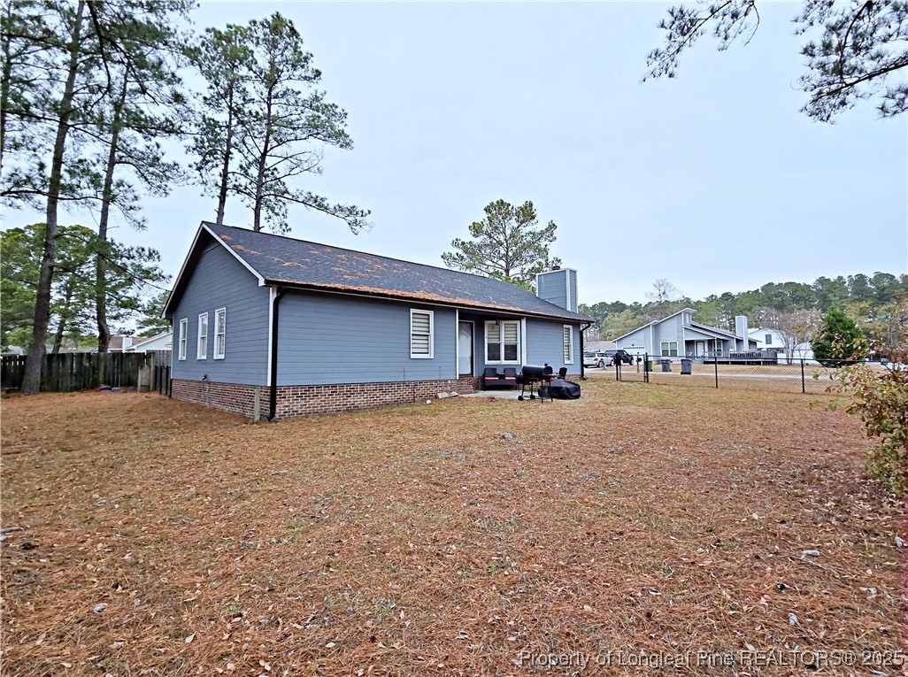 5309 Tory Hill Road Hope Mills, NC 28348 - Photo 34 of 45 a house with trees in front of it