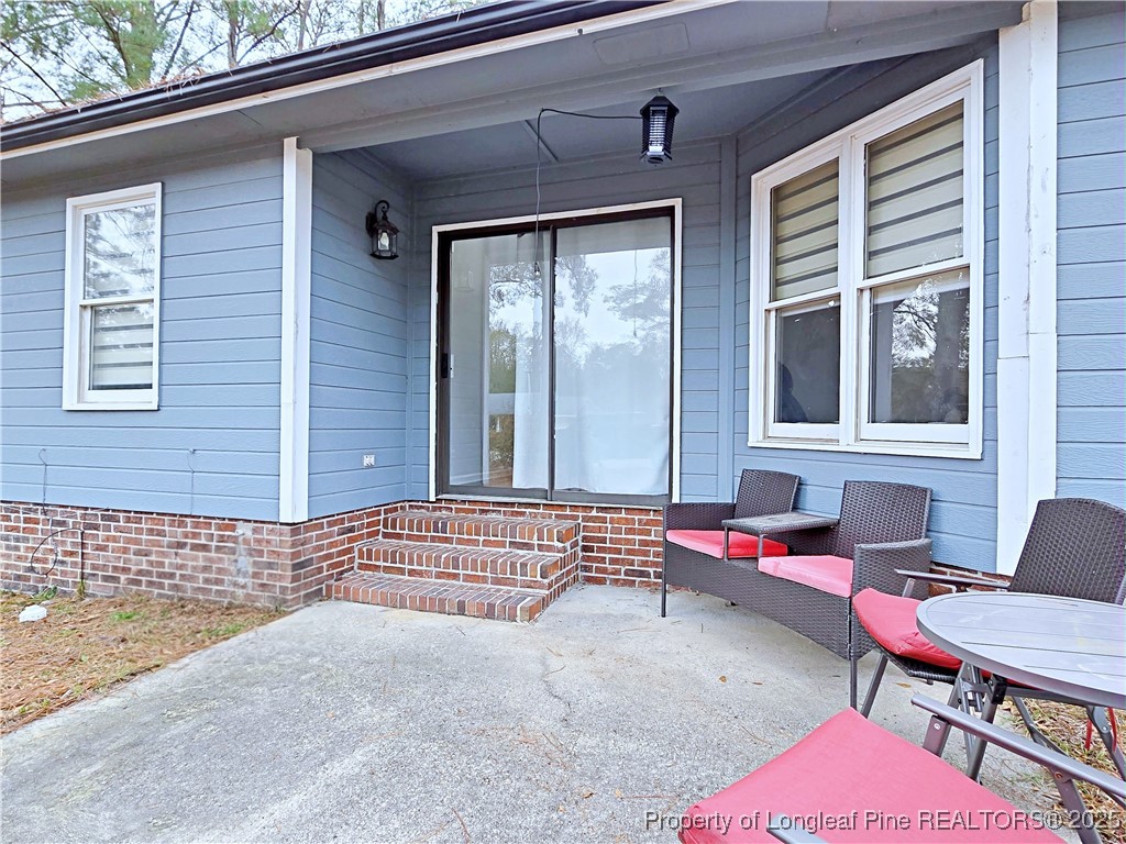 5309 Tory Hill Road Hope Mills, NC 28348 - Photo 39 of 45 a backyard of a house with outdoor seating