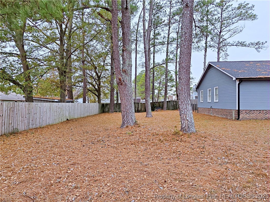 5309 Tory Hill Road Hope Mills, NC 28348 - Photo 41 of 45 a house with trees in front of it